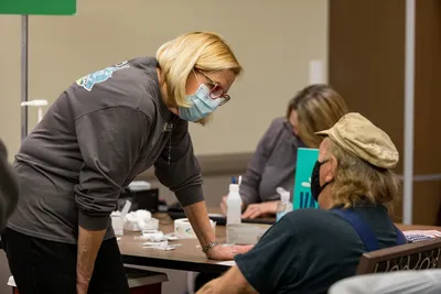 2021.03.15 MedCenter Health vaccine clinic volunteers 0227